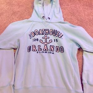 Light blue Orlando boathouse sweatshirt.